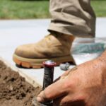 technician installing sprinkler head